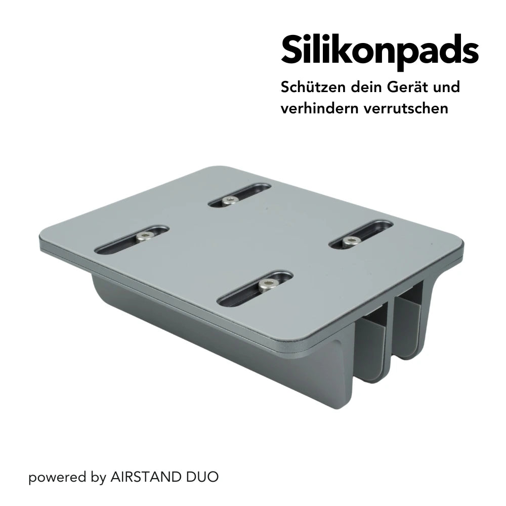 AIRSTAND DUO mit Silikonpads, die das Gerät schützen und ein Verrutschen verhindern. Der Ständer ist stabil und sorgt für sicheren Halt, ideal für den täglichen Einsatz. Text: „Silikonpads – Schützen dein Gerät und verhindern Verrutschen“.